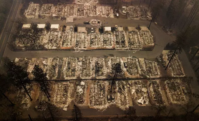 FILE - Residences leveled by a wildfire in Paradise, Calif., are seen on Nov. 15, 2018. (AP Photo/Noah Berger, File)