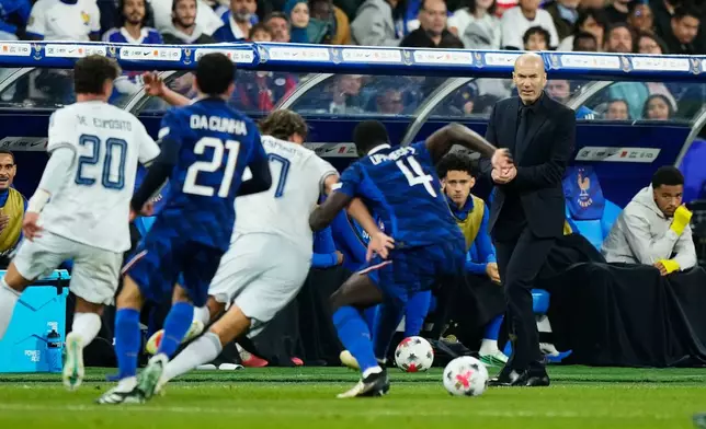 France's head coach Zinedine Zidane, right, looks on during the UEFA Nations League Group A soccer match between France and Italy in Saint-Denis near Paris, Friday, Oct. 2, 2026. (AP Photo/Teresa Suarez)
