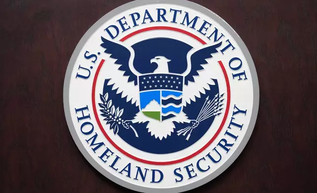 U.S. Department of Homeland Security sign, is seen during a news conference at ICE Headquarters, Friday, Oct. 9, 2026, in Washington. (AP Photo/Jacquelyn Martin)