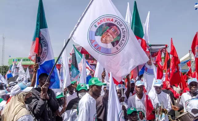 Supporters of Nigeria incumbent president, Bola Tinubu, of the All Progressives Congress Party, attend the Presidential election campaign flag off in Kaduna, Nigeria, Saturday, Oct. 24, 2026. (AP Photo/Sani Maikatanga)