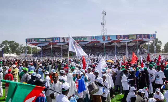 Supporters of Nigeria incumbent president, Bola Tinubu, of the All Progressives Congress Party, attend the Presidential election campaign flag off in Kaduna, Nigeria, Saturday, Oct. 24, 2026. (AP Photo/Sani Maikatanga)