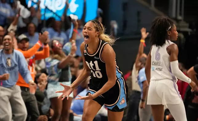 Atlanta Dream guard Rhyne Howard (10) reacts after scoring during the first half of Game 3 of the WNBA basketball finals against the Golden State Valkyries on Wednesday, Oct. 21, 2026, in Atlanta. (AP Photo/Brynn Anderson)