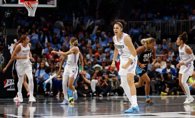 Golden State Valkyries forward Janelle Salaün (13) reacts after making a 3-point basket against the Atlanta Dream during the first half of Game 3 of the WNBA basketball finals on Wednesday, Oct. 21, 2026, in Atlanta. (Santiago Mejia/San Francisco Chronicle via AP)
