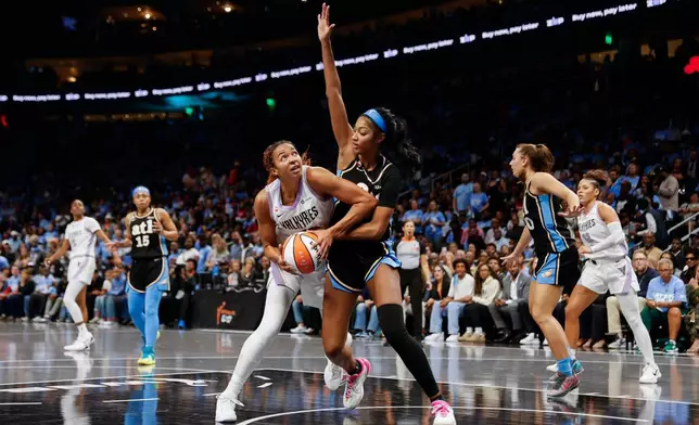 Golden State Valkyries center Kiah Stokes (41) is defended by Atlanta Dream forward Angel Reese (5) during the second half of Game 3 of the WNBA basketball finals on Wednesday, Oct. 21, 2026, in Atlanta. (Santiago Mejia/San Francisco Chronicle via AP)