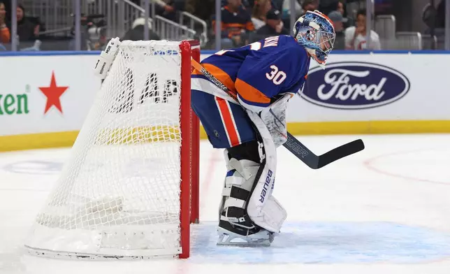 New York Islanders goaltender Ilya Sorokin (30) stands in the goal during the first period of an NHL hockey game against the Tampa Bay Lightning, Saturday, Oct. 10, 2026, in Elmont, N.Y. (AP Photo/Pamela Smith)