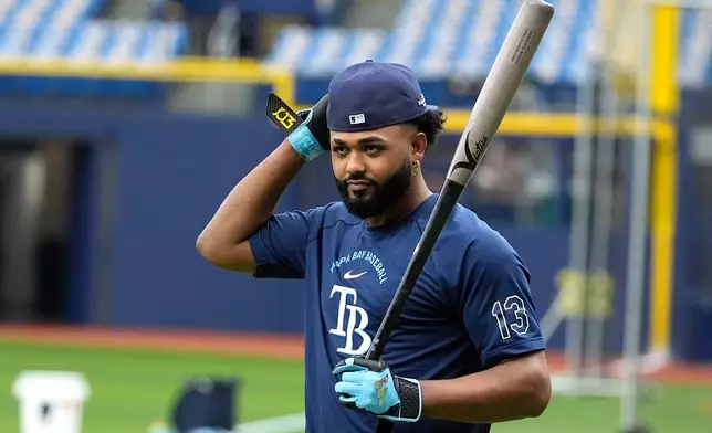 Tampa Bay Rays' Junior Caminero walks to the batting cage during practice in a baseball American League Championship Series against the Cleveland Guardians Sunday, Oct. 11, 2026, in St. Petersburg, Fla. (AP Photo/Chris O'Meara)