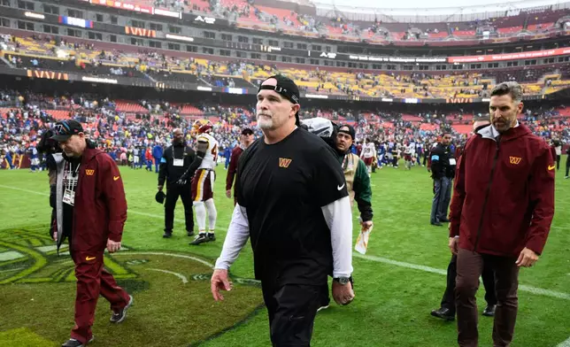 Washington Commanders head coach Dan Quinn leaves the field after an NFL football game against the New York Giants in Landover, Md., Sunday, Oct. 11, 2026. (AP Photo/Nick Wass)