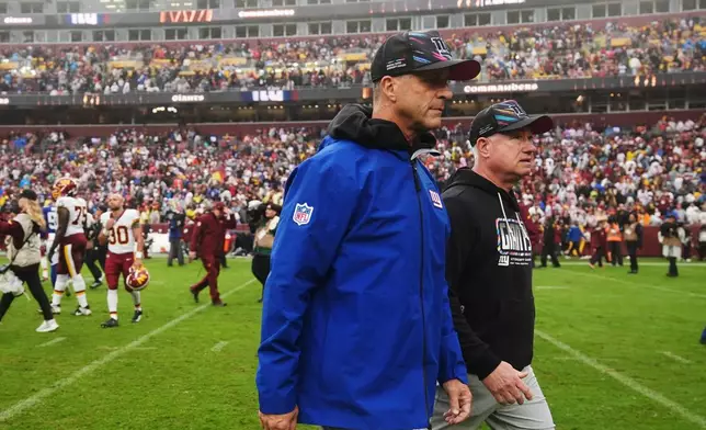 New York Giants head coach John Harbaugh leaves the field after an NFL football game against the Washington Commanders in Landover, Md., Sunday, Oct. 11, 2026. (AP Photo/Stephanie Scarbrough)