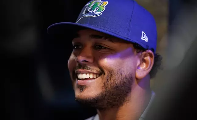 Tampa Bay Rays pitcher Freddy Peralta speaks during a World Series baseball media day, Thursday, Oct. 22, 2026, in Milwaukee, ahead of Game 1 between the Milwaukee Brewers and the Tampa Bay Rays. (AP Photo/Kayla Wolf)