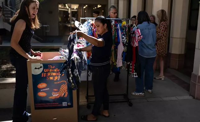 People gather at a Halloween costume swap at Occidental College in Los Angeles, Friday, Oct. 16, 2026. (AP Photo/Jae C. Hong)