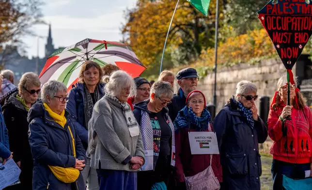 People take part in a protest outside the U.S. Consulate in support of Palestine Action ahead of a U.K. Supreme Court hearing over the group's proscription in Edinburgh, Scotland, Saturday, Oct. 31, 2026. (Jane Barlow/PA via AP)