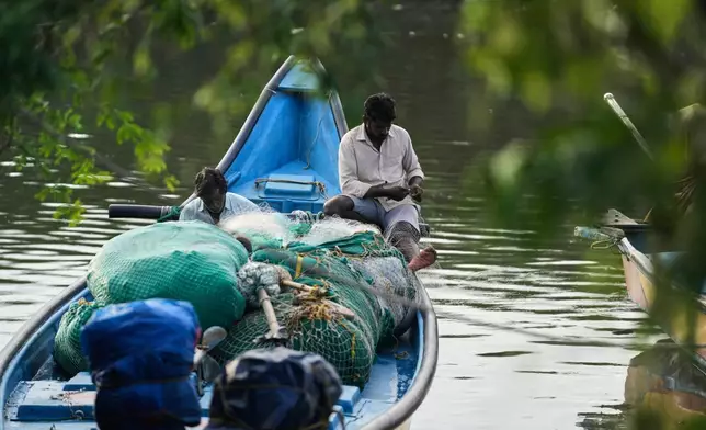Fishermen prepare their nets in the backwaters in Kakinada, India, Thursday, Oct. 29, 2026, a day after Cyclone Arnab crossed the Andhra Pradesh coast. (AP Photo/Mahesh Kumar A.)