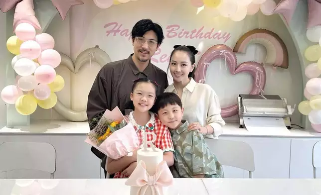 譚俊彥一家四口。