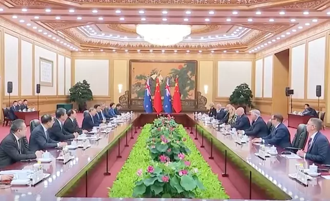 李強晤拉克森。央視截圖