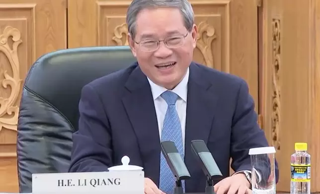 李強晤拉克森。央視截圖