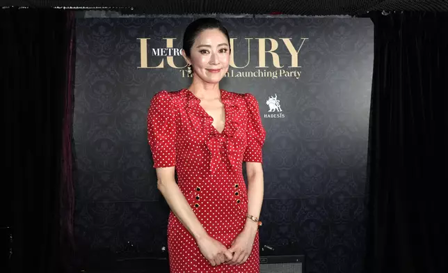 商界名人才女張玉珊罕有露面撐場，以一身華麗盛裝打扮現身。