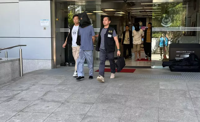 內地人充網約車司機，警方再拘2男1女。巴士的報記者攝