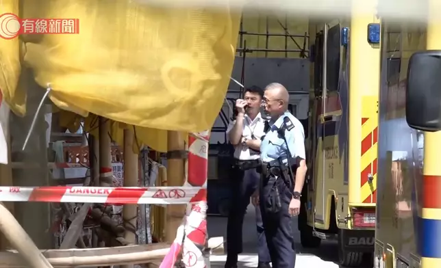 警員在現場了解事件。有線新聞圖片