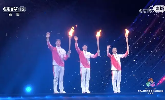 左起張家朗、蘇炳添和李禕。央視圖片