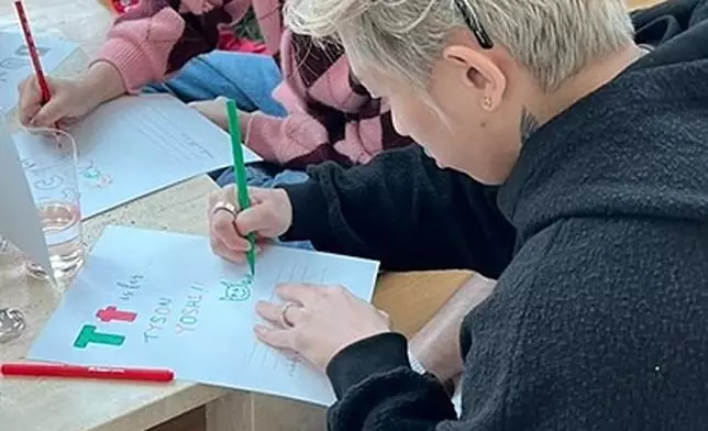 Tyson 與太太Christy 一齊寫上祝福