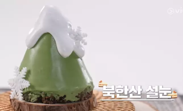 金鎮敘首回合以「北漢山春雪」為名創作麵包，將店鋪所在地融入作品成功晉級。Viu提供圖片