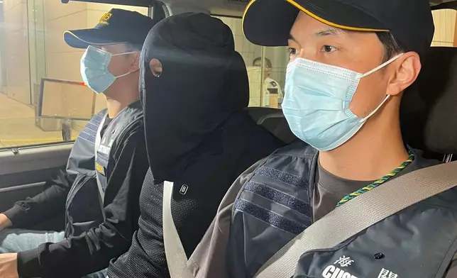 第二宗案件的懷疑涉案男子（中）。政府新聞處圖片