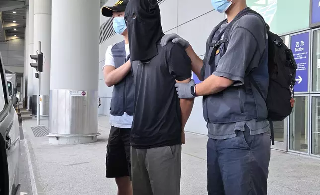 第二宗案件的被捕人士（中）。政府新聞處圖片