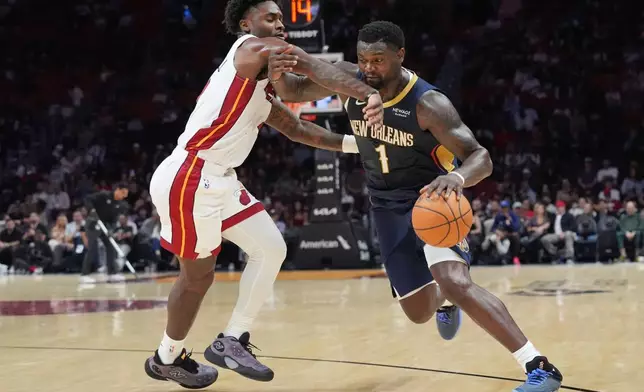 2026年10月8日，邁阿密，NBA季前賽，熱火隊後衛戴維安米曹在對陣塘鵝隊的比賽上半場防守塘鵝隊前鋒錫安威廉臣（1號）。(美聯社圖片/Marta Lavandier) AP圖片