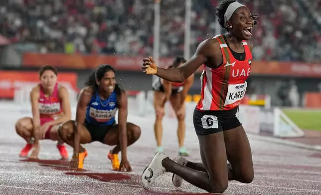 阿拉伯聯合酋長國選手卡里姆在日本名古屋舉行的亞洲運動會女子400米跨欄決賽中奪冠後作出反應。攝於2026年9月28日周一。(美聯社圖片/Dita Alangkara) AP圖片