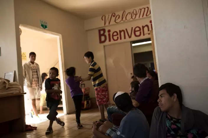 Central American migrants traveling with a caravan wait to be registered at the Viña de Cristo shelter in Tijuana, Mexico, Wednesday, April 25, 2018. The caravan of mainly Central American migrants are planning to request asylum, either in the United States or Mexico. (AP Photo/Hans-Maximo Musielik)