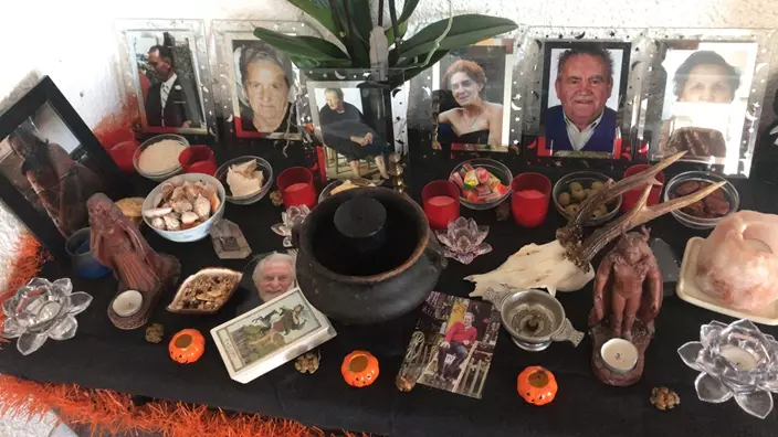 Pictures of Sonia's family members, who she protects with spells (Collect/PA Real Life)