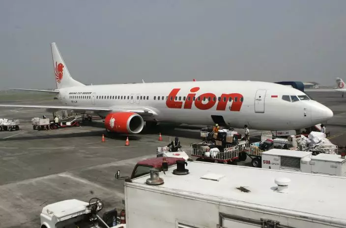 FILE - In this May 12, 2012 file photo, a Lion Air passenger jet is parked on the tarmac at Juanda International Airport in Surabaya, Indonesia. Indonesia's Lion Air said Monday, Oct. 29, 2018, it has lost contact with a passenger jet flying from Jakarta to an island off Sumatra. (AP PhotoTrisnadi, File)