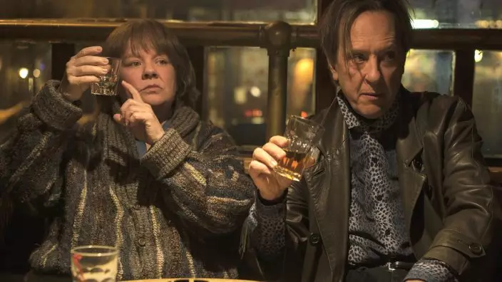 This image released by Fox Searchlight Films shows Melissa McCarthy, left, and Richard E. Grant in a scene from "Can You Ever Forgive Me?" (Mary CybulskiFox Searchlight via AP)