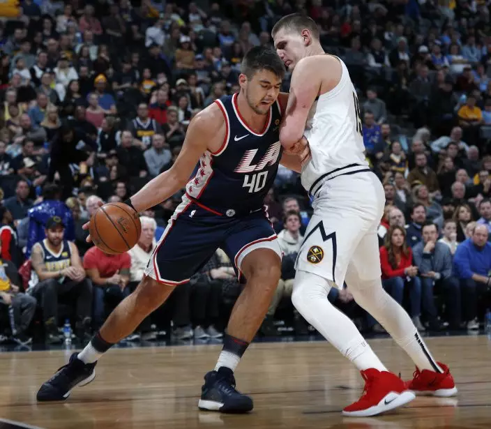 Los Angeles Clippers center Ivica Zubac, left, drives to the rim as Denver Nuggets center Nikola Jokic defends in the first half of an NBA basketball game Sunday, Feb. 24, 2019, in Denver. (AP PhotoDavid Zalubowski)