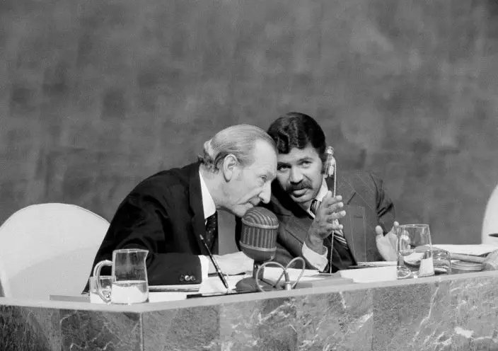 FILE - In this Sept. 18, 1974, President Abdelaziz Bouteflika of Algeria, right, and UN Secretary-General Kurt Waldheim confer during the opening of the General Assembly in New York. Algeria's longtime leader Abdelaziz Bouteflika has been known as a wily political survivor ever since he fought for independence from France in the 1960s, and now in 2019, he needs to overcome mass protests against his rule. (AP PhotoMarty Lederhandler, File)