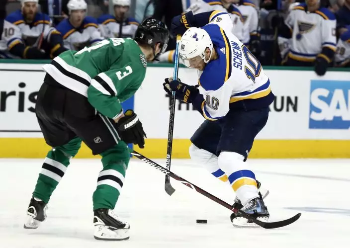 St. Louis Blues' Brayden Schenn (10) brings the puck down the ice as Dallas Stars' John Klingberg (3), of Sweden, defends during the second period in Game 6 of an NHL second-round hockey playoff series, Sunday, May 5, 2019, in Dallas. (AP PhotoTony Gutierrez)