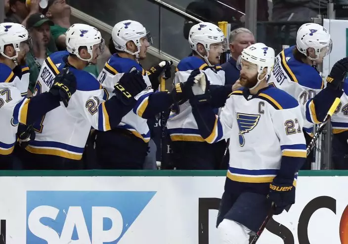St. Louis Blues' Alex Pietrangelo (27) is congratulated by teammates after scoring during the first period in Game 6 of an NHL second-round hockey playoff series against the Dallas Stars, Sunday, May 5, 2019, in Dallas. (AP PhotoTony Gutierrez)