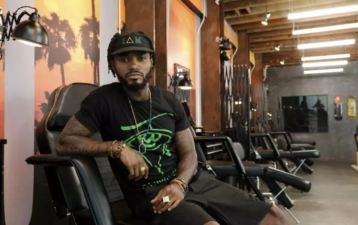 This Aug. 15, 2019 photo shows Danny "KP" Kilpatrick, a cast member in the reality television series "Black Ink Crew: Compton," at the IAM Compton tattoo shop in Compton, Calif. The show, which airs Wednesdays on VH1, follows the cast who attempt to create a “safe zone” in one of the tougher cities in California. The reality series is the third spinoff of the “Black Ink Crew” franchise. (Photo by Chris PizzelloInvisionAP)