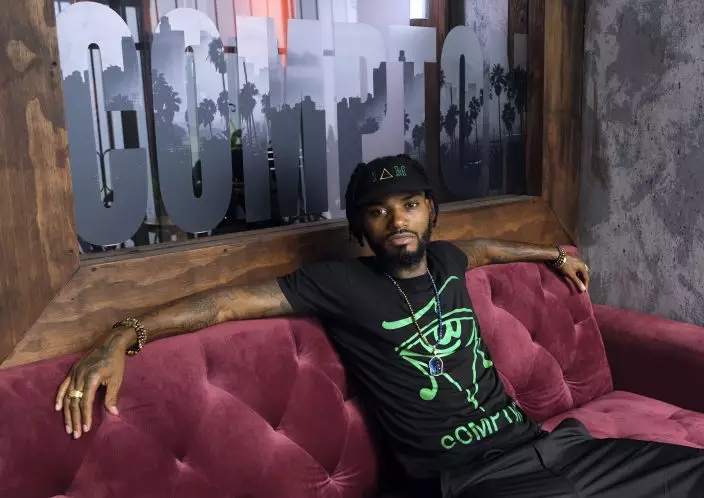 This Aug. 15, 2019 photo shows Danny "KP" Kilpatrick, a cast member in the reality television series "Black Ink Crew: Compton," at the IAM Compton tattoo shop in Compton, Calif. The show, which airs Wednesdays on VH1, follows the cast who attempt to create a “safe zone” in one of the tougher cities in California. The reality series is the third spinoff of the “Black Ink Crew” franchise. (Photo by Chris PizzelloInvisionAP)