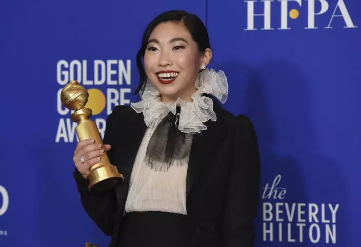 Awkwafina poses in the press room with the award for best performance by an actress in a motion picture, musical or comedy for "The Farewell" at the 77th annual Golden Globe Awards at the Beverly Hilton Hotel on Sunday, Jan. 5, 2020, in Beverly Hills, Calif. (AP PhotoChris Pizzello)