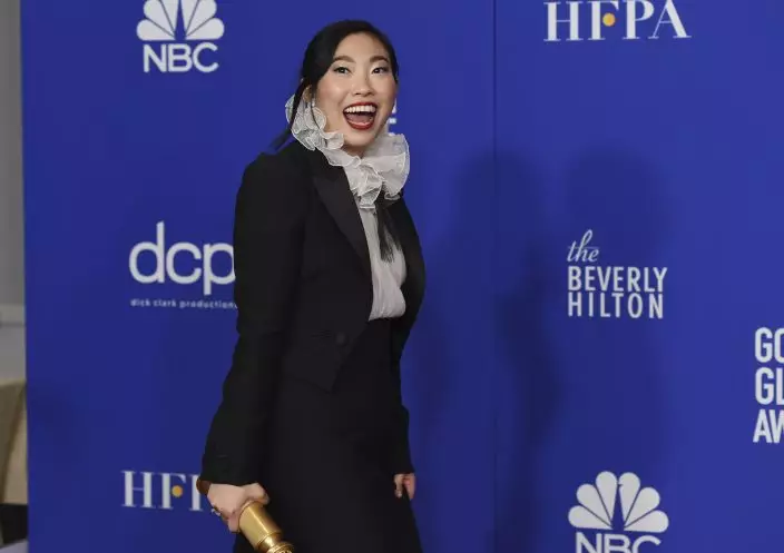 Awkwafina poses in the press room with the award for best performance by an actress in a motion picture, musical or comedy for "The Farewell" at the 77th annual Golden Globe Awards at the Beverly Hilton Hotel on Sunday, Jan. 5, 2020, in Beverly Hills, Calif. (AP PhotoChris Pizzello)