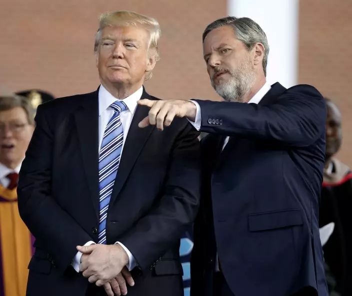 FILE - In this May 13, 2017 file photo, President Donald Trump stands with Liberty University President Jerry Falwell Jr. in Lynchburg, Va. On Tuesday, Aug. 25, 2020, Falwell said that he has submitted his resignation as head of evangelical Liberty University. (AP PhotoSteve Helber)