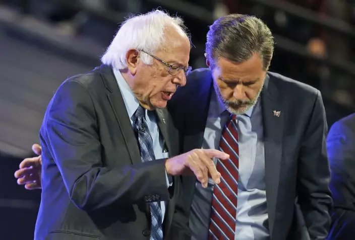 FILE - In this Monday, Sept. 14, 2015 file photo, Democratic presidential candidate, Sen. Bernie Sanders, I-Vt., left, talks with Liberty Univerisity president Jerry Falwell Jr., at the university in Lynchburg, Va. On Tuesday, Aug. 25, 2020, Falwell said that he has submitted his resignation as head of evangelical Liberty University. (AP PhotoSteve Helber)