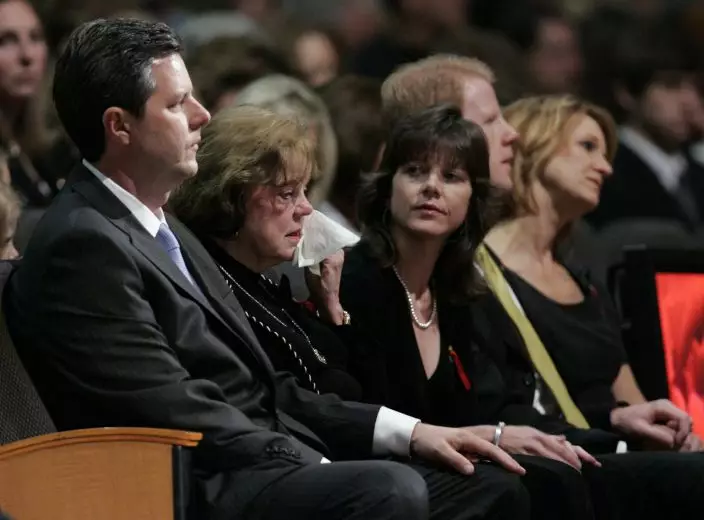 FILE - In this May 22, 2007 file photo, Macel Falwell, second from left, wipes a tear as she and her son, Jerry Falwell Jr., left; daughter, Jeannie Savas; Jonathan Falwell, background second from right, and his wife, Shari Falwell, right, attend the funeral for the Rev. Jerry Falwell at the Thomas Road Baptist Church in Lynchburg, Va. On Tuesday, Aug. 25, 2020, Jerry Falwell Jr. said that he has submitted his resignation as head of evangelical Liberty University. (AP PhotoSteve Helber, Pool)
