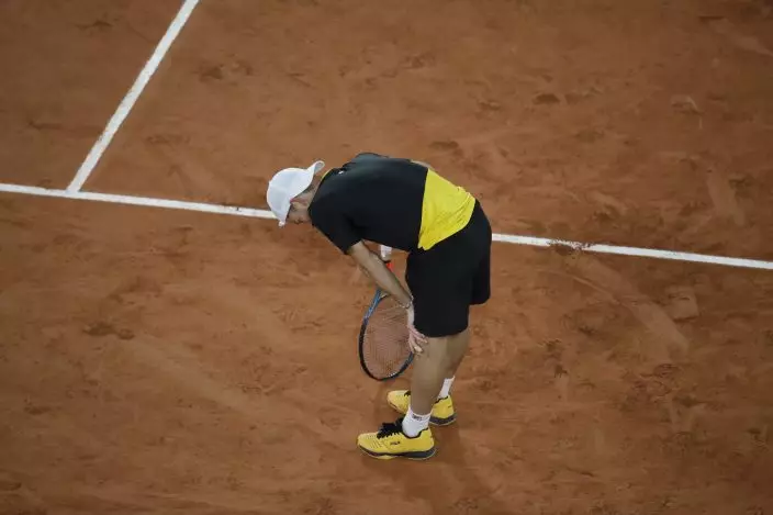 Argentina's Diego Schwartzman catches his breath after a rally in the fourth set of the quarterfinal match of the French Open tennis tournament against Austria's Dominic Thiem at the Roland Garros stadium in Paris, France, Tuesday, Oct. 6, 2020. (AP PhotoAlessandra Tarantino)
