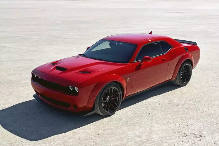 This photo provided by Stellantis shows the 2022 Dodge Challenger. As a larger sedan than its competition, it is more suited to daily driving than perhaps most V8 coupes. (Courtesy of Stellantis via AP)
