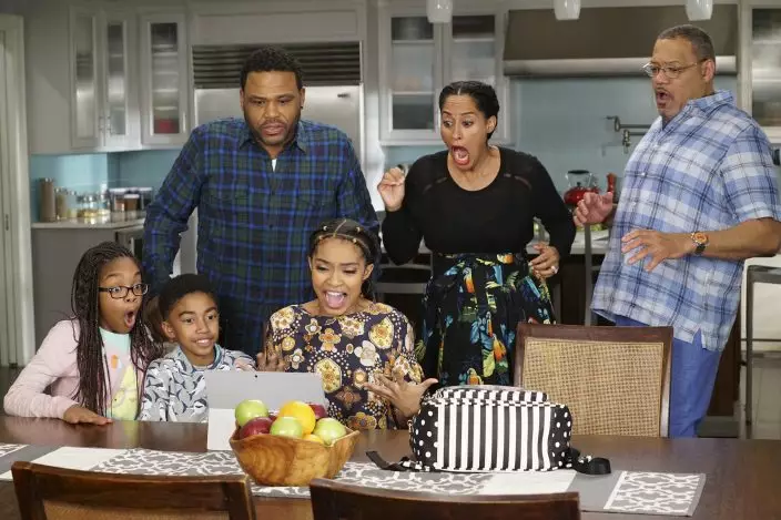 This image released by ABC shows, seated from left, Marsai Martin, Miles Brown and Yara Shahidi and, standing from left, Anthony Anderson, Tracee Ellis Ross and Laurence Fishburne in "black-ish." The series put an affluent and devoted family of color, the Johnsons, at the center of attention and let Black creators tell their stories. The series finale airs Tuesday, April 19. (Ron TomABC via AP)