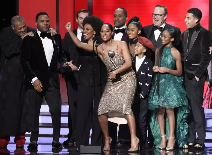 FILE - The cast and crew of "black-ish," from left, Laurence Fishburne, Anthony Anderson, Jeff Mecham, Jenifer Lewis, Tracee Ellis Ross, Kenya Barris, Yara Shahidi, Miles Brown, Peter Mackenzie, Marsai Martin, and Marcus Scribner, accepts the award for outstanding comedy series at the 49th annual NAACP Image Awards on Jan. 15, 2018, in Pasadena, Calif. The series put an affluent and devoted family of color at the center of attention and let Black creators tell their stories. The series finale airs Tuesday, April 19. (Photo by Chris PizzelloInvisionAP, File)