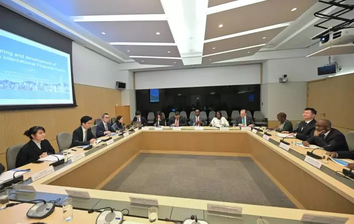 A delegation of 13 overseas government officials completed its visit to Hong Kong today (May 29). Photo shows the delegation meeting with the Under Secretary for Financial Services and the Treasury, Mr Joseph Chan (second left), to explore financial co-operation opportunities. Source: HKSAR Government Press Releases