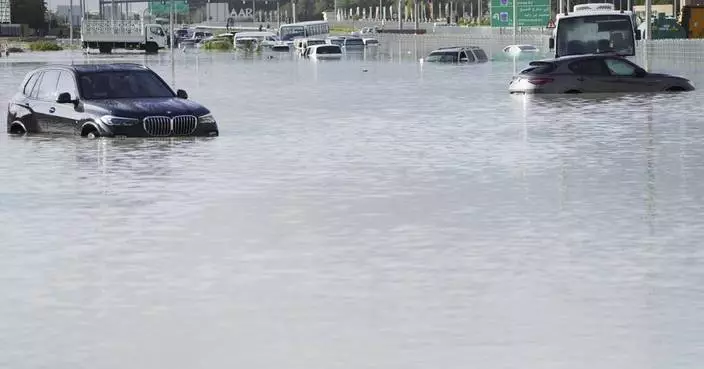 A storm dumps record rain across the desert nation of UAE and floods the Dubai airport